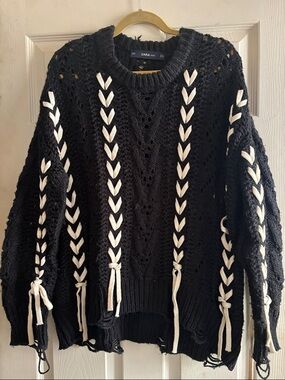 Zara black chunky distressed sweater with white braided lacing throughout